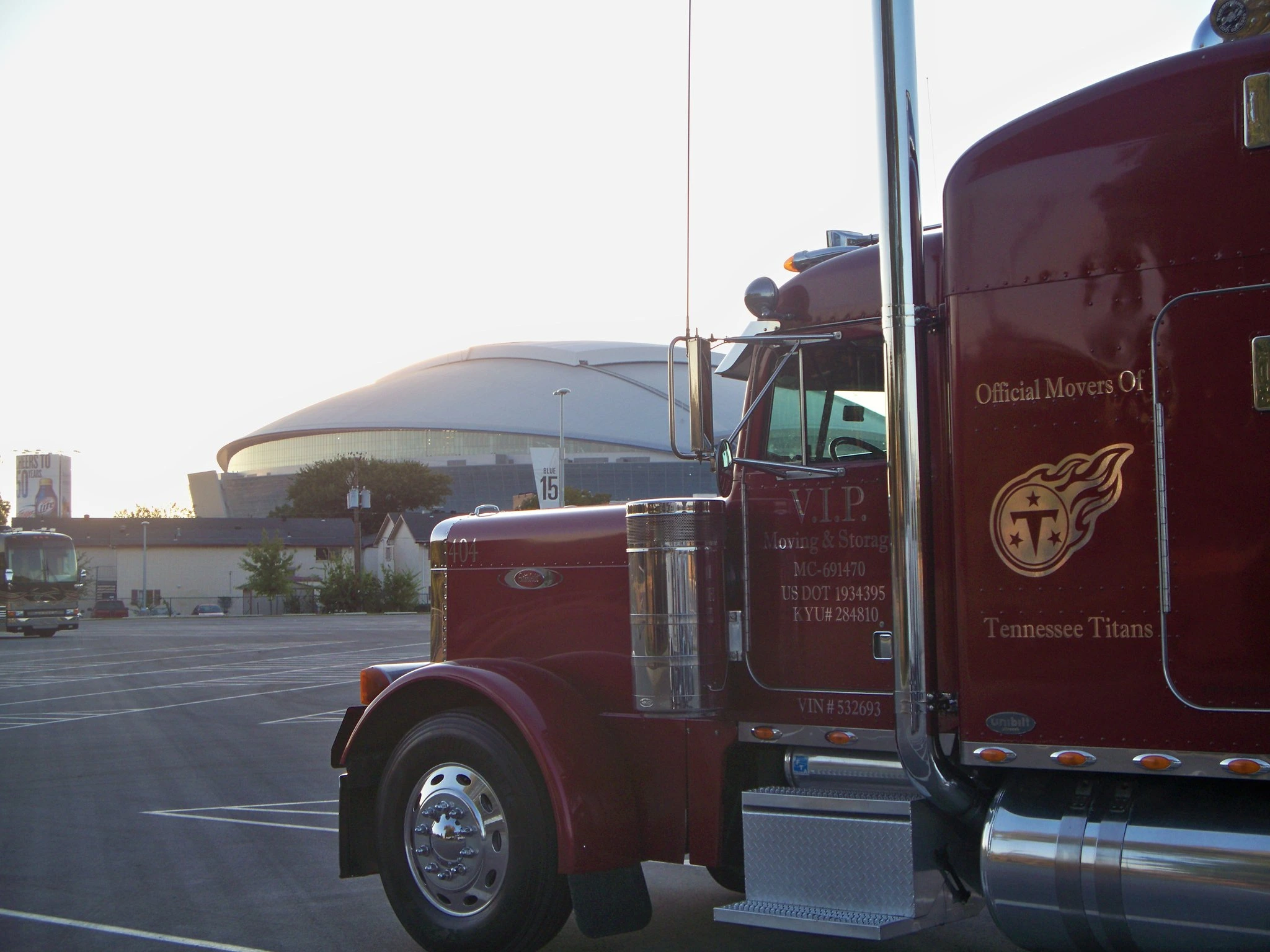 Red VIP truck with Titans branding at stadium