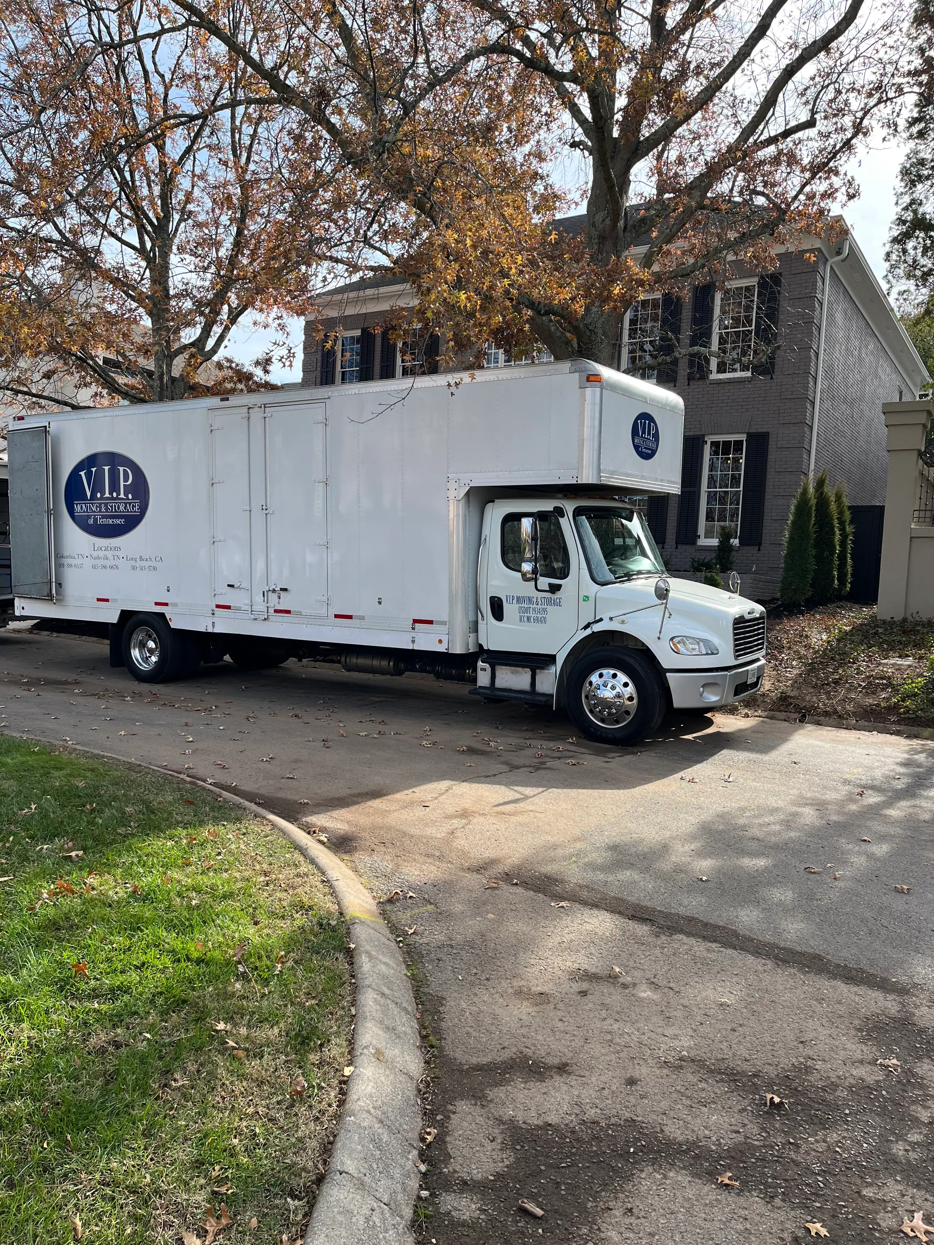 VIP truck at residential home in fall